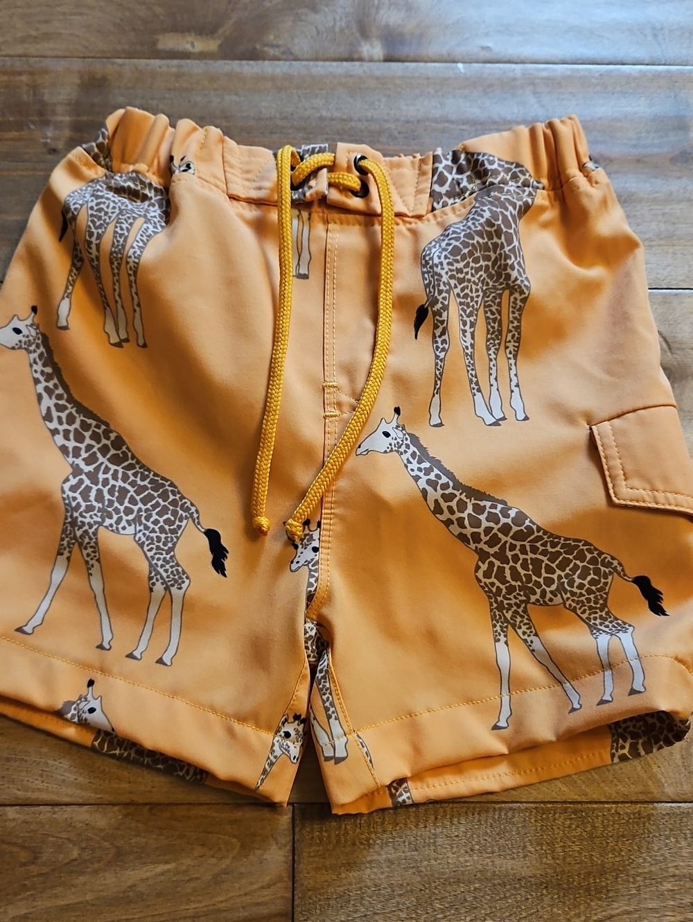 Kids Orange Giraffe Print Swim Shorts
